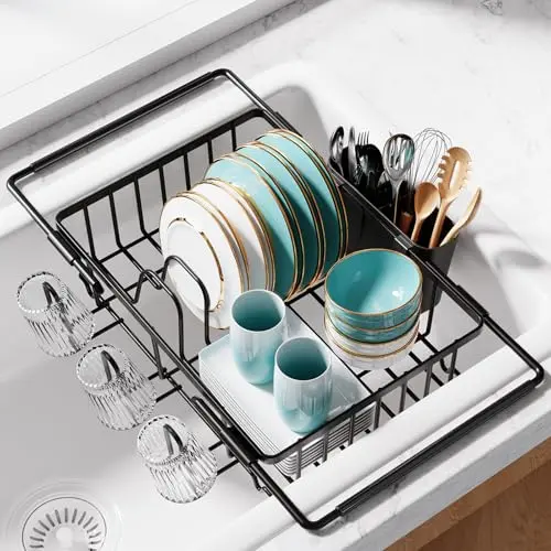 Sakugi black expandable stainless steel dish rack with cup holders on a kitchen counter.